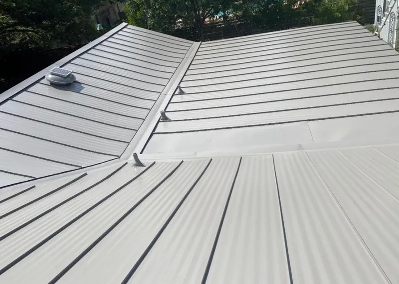 Solar attic fan installed on a metal roof for Roof Ventilation in Estero